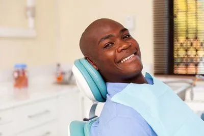 man smiling during his dental visit to Sycamore Family Dentistry