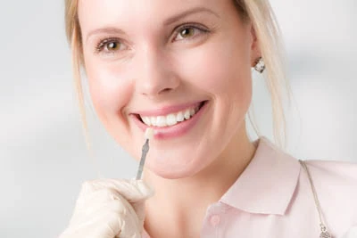 patient picking a dental veneer color at Sycamore Family Dentistry