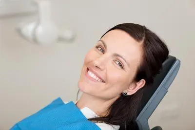 woman smiling during her first visit to Sycamore Family Dentistry